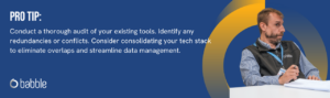 This graphic visually represents a "pro tip" that suggests auditing your stack to eliminate redundancies. It features an image of a man sitting at his desk with a pen in his hand.