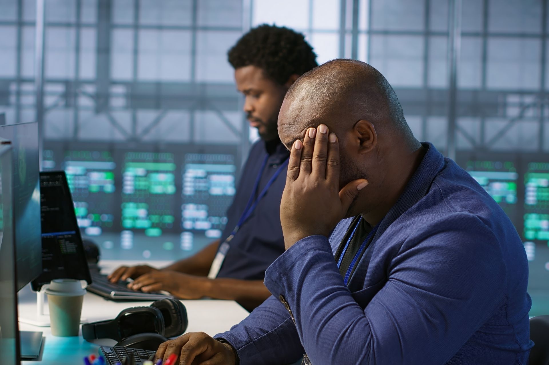 This is an image of a frustrated man in an office.