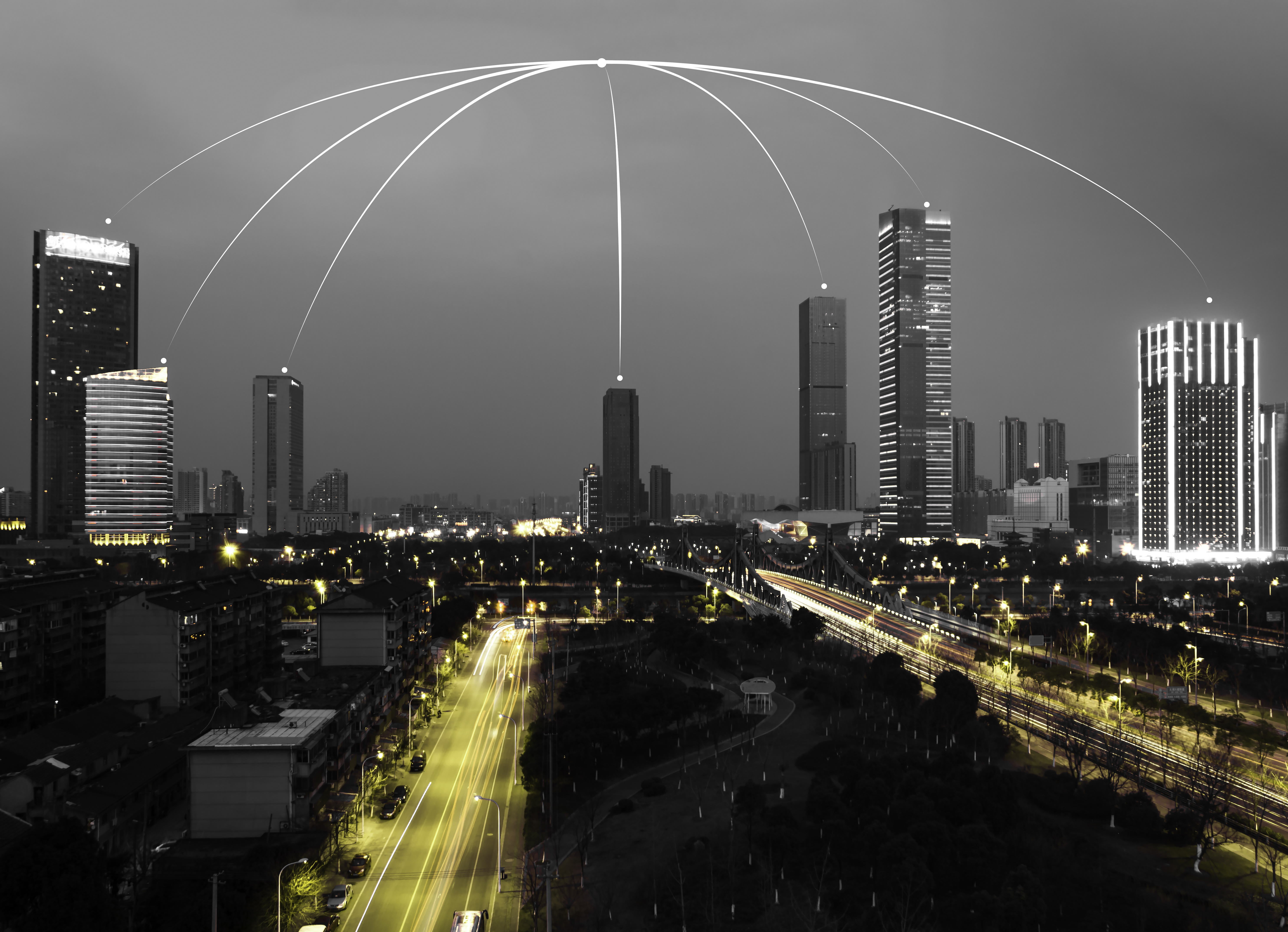 This is an image of a city with lights connecting the buildings.